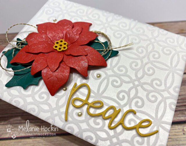 poinsettia card with plush poinsettia paper, shimmer paint, and peace die